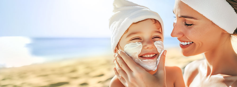 mom-with-child-applying sunscreen to protect from UV rays and skin cancer